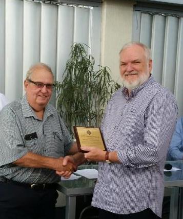 Bernie Christensen being presented with his life membership plaque and name tag by QPLS President Greg Tutt
